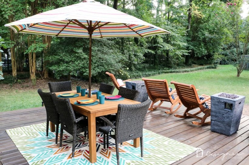 backyard deck with teak and acacia furniture