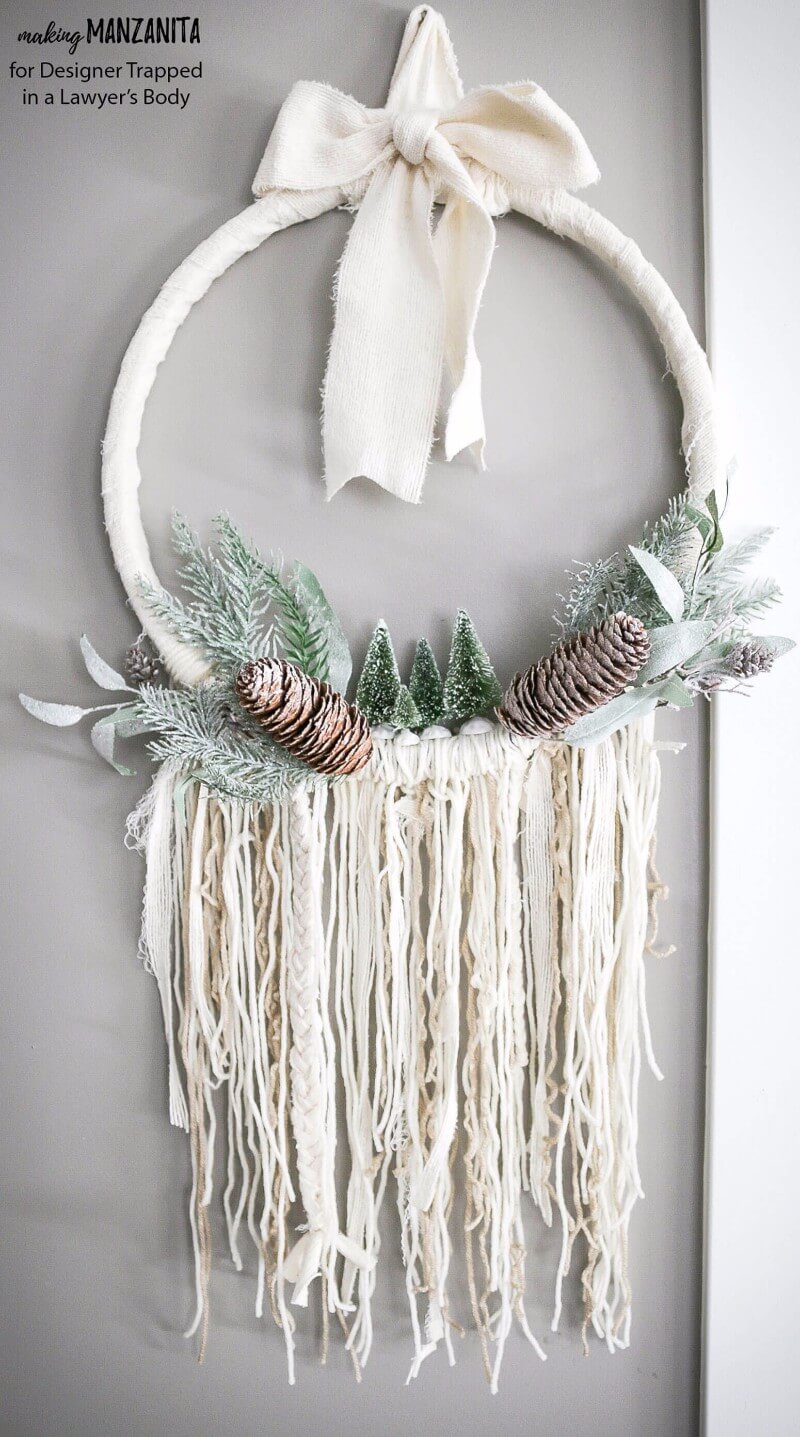 This DIY winter wreath is an easy way to add a touch of Winter beauty to your home! The Boho style of this winter wreath is so fun and different.