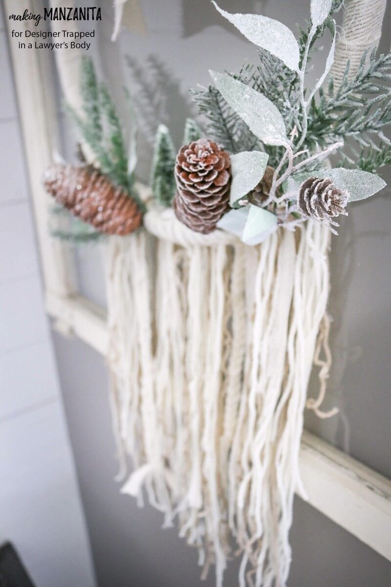 This DIY winter wreath is an easy way to add a touch of Winter beauty to your home! The Boho style of this winter wreath is so fun and different.