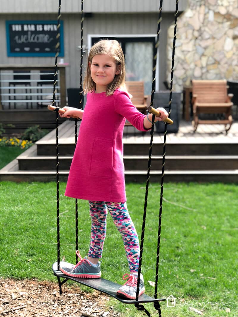 This DIY swing is a perfect addition to any back yard. It's easy to make and can be used as a standing swing or a sitting swing. All you need is a tree to attach it to! Make one for your kids with this easy tutorial.