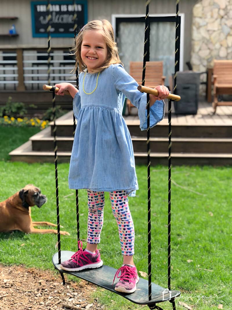 This DIY swing is a perfect addition to any back yard. It's easy to make and can be used as a standing swing or a sitting swing. All you need is a tree to attach it to! Make one for your kids with this easy tutorial.