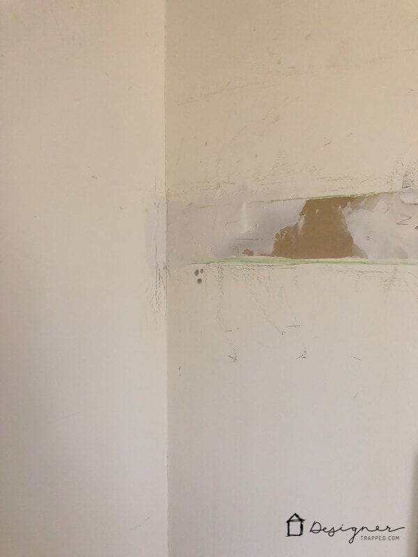 drywall repair showing wet spackling paste