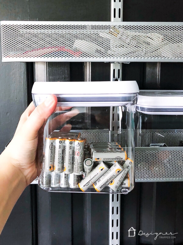 batteries in clear container in linen closet