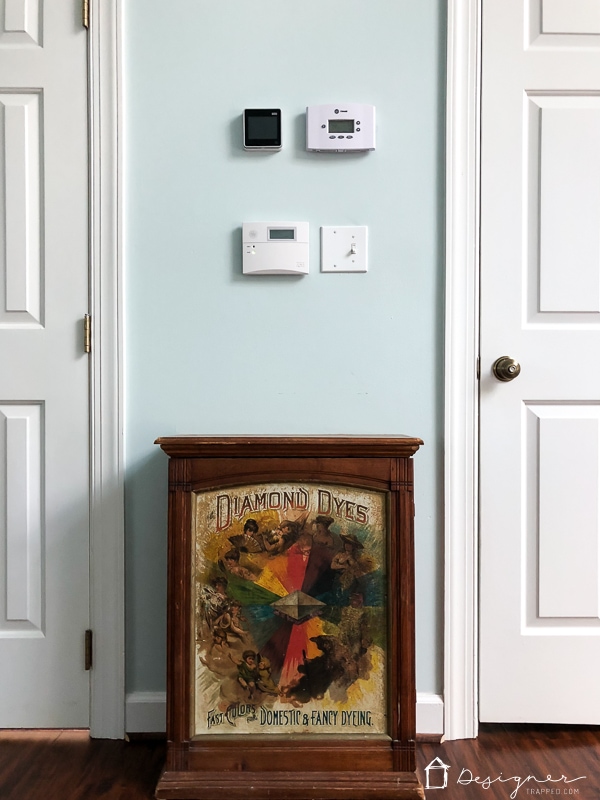 thermostat and alarm pad on wall