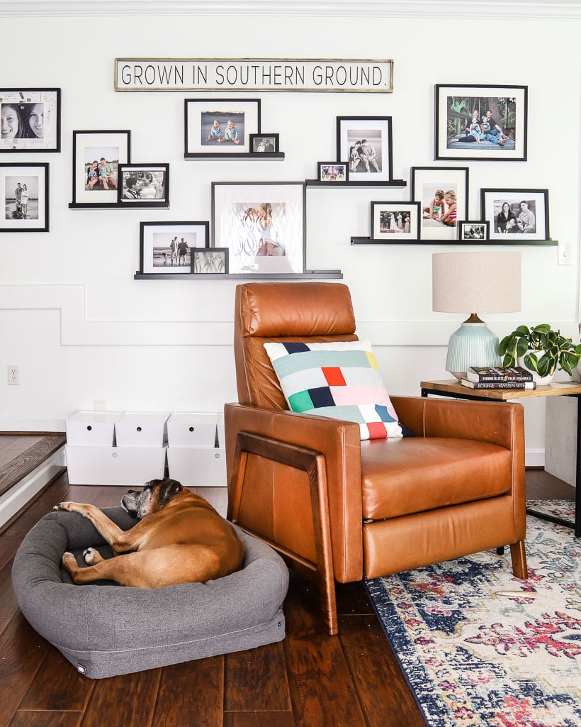 mix of black and white and color family photos displayed on ledges