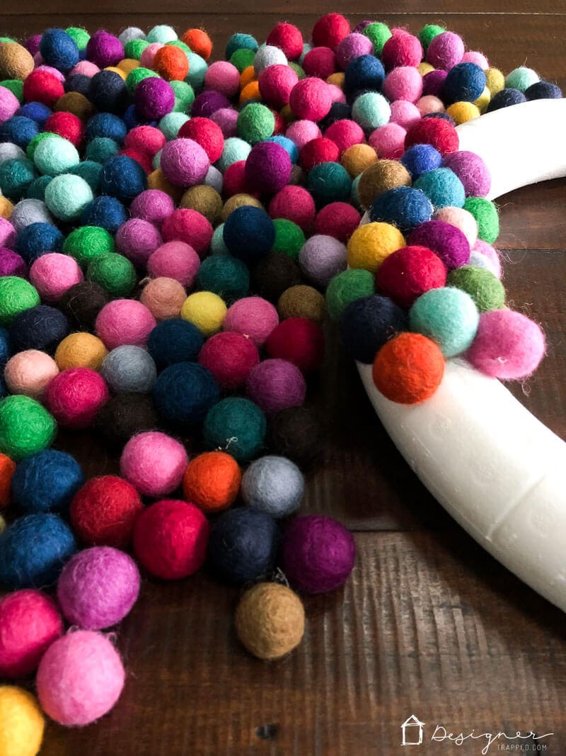 colorful DIY felt ball wreath in progress