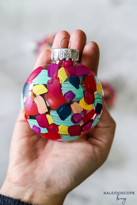 colorful plastic ornament in hand