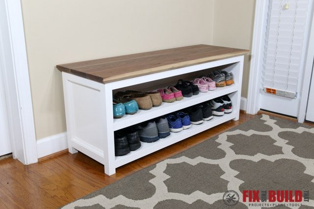 white wood bench with shoe storage shelves and natural wood top