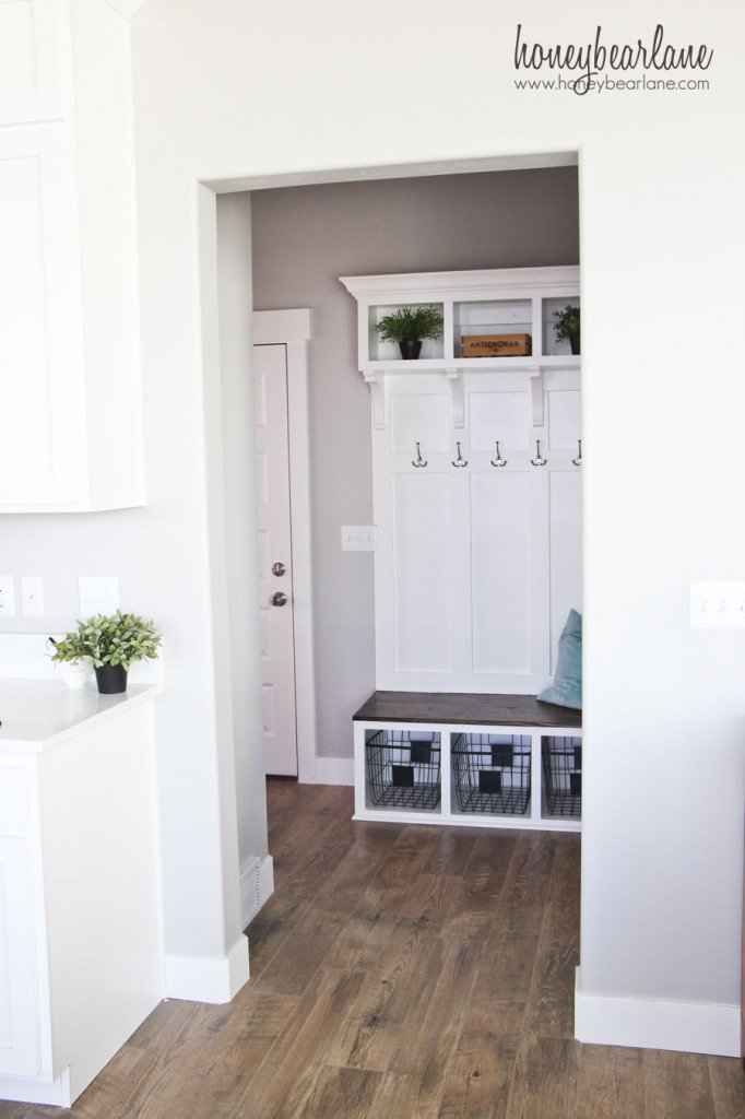 white mudroom lockers with bench and hooks