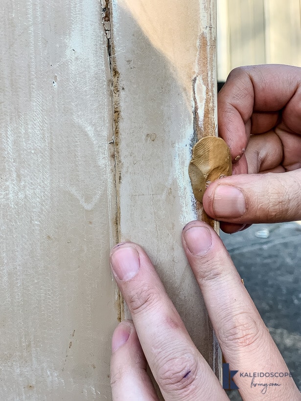filling damaged spot with putty
