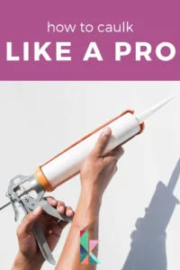 caulk gun being held up