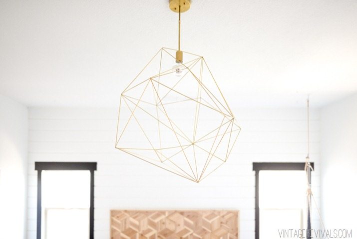 Giant geometric brass light fixture