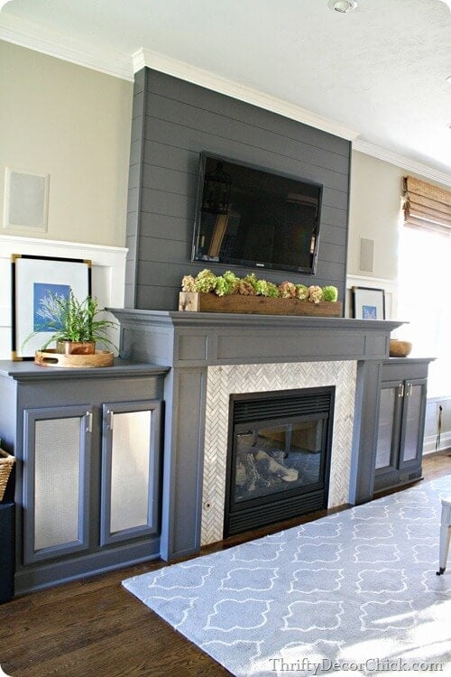 grey fireplace makeover with herringbone tile