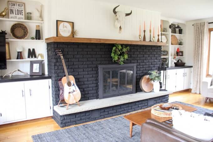 painted black brick fireplace