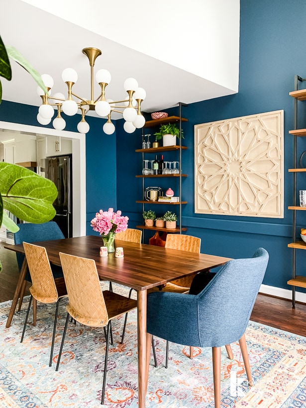 navy blue dining room with colorful rug