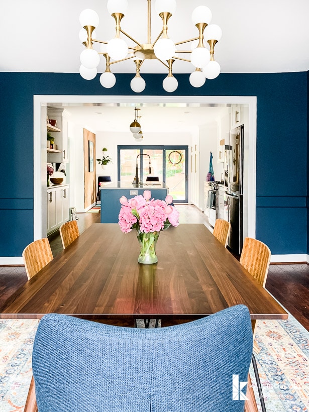 navy blue dining room open to kitchen