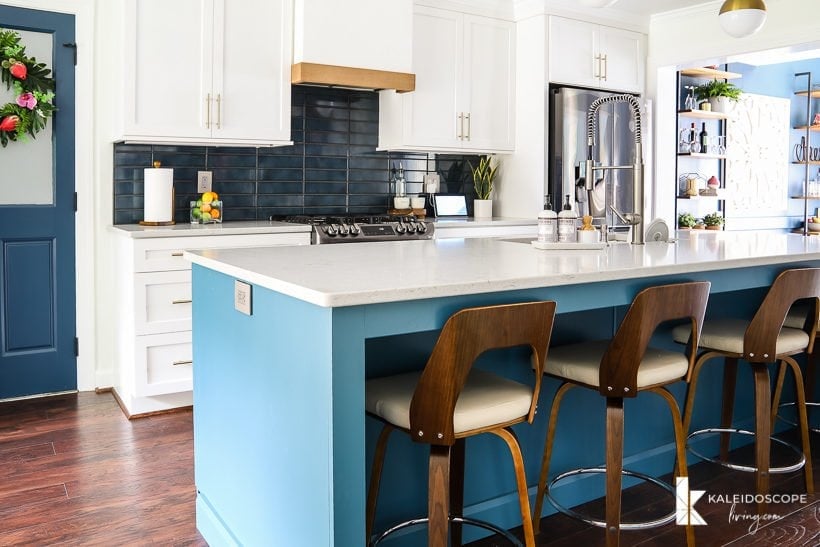 kitchen with teal blue tile backsplash