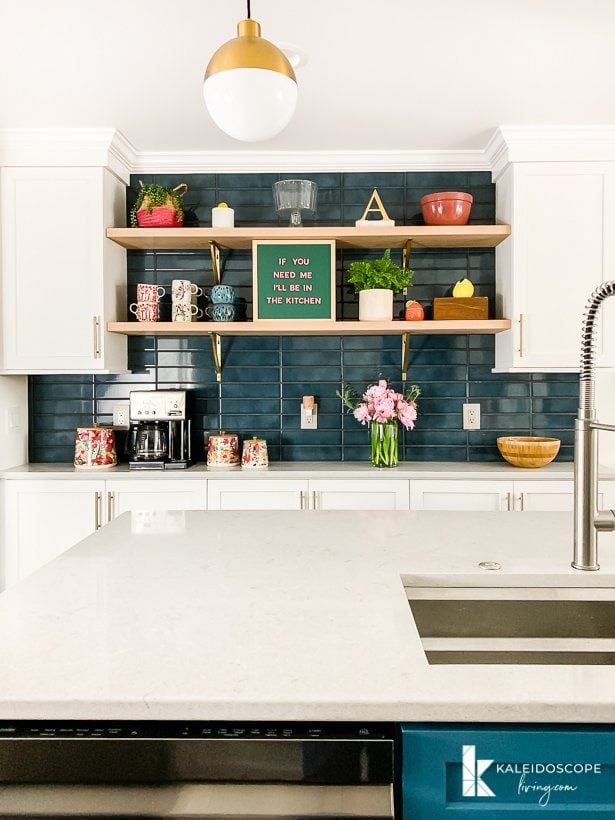 kitchen with teal blue tile backsplash