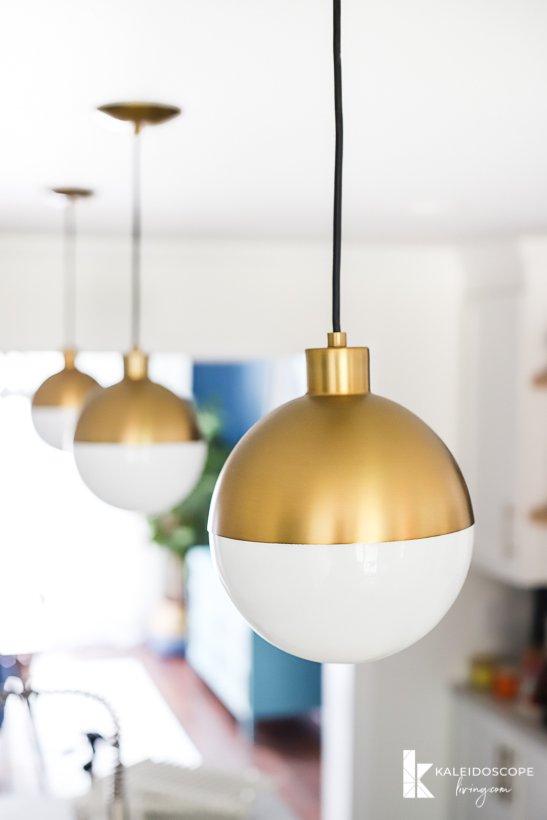 modern gold and white pendant lights in kitchen remodel