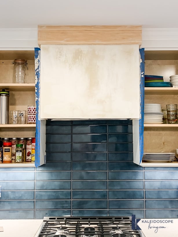 white skimcoat on range hood drying