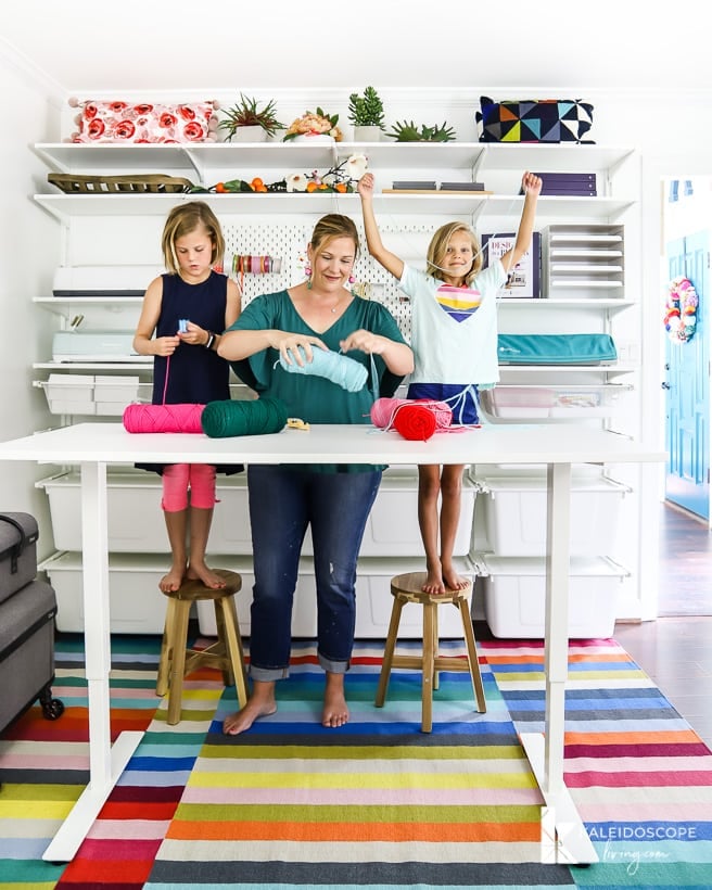 colorful craft room with IKEA Algot storage and standing table