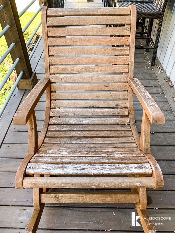worn and weathered acacia outdoor rocking chair