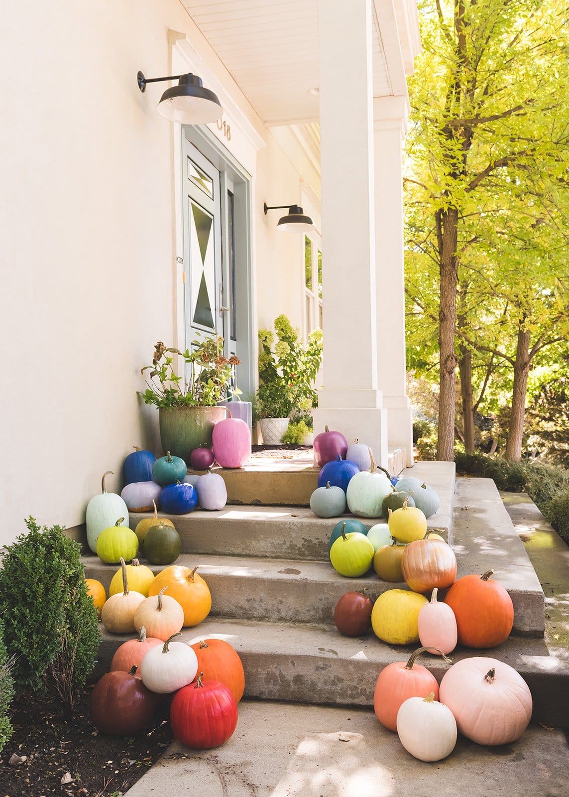 rainbow pumpkins on porch