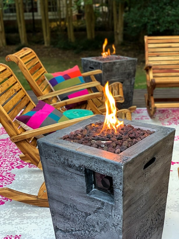 fire columns on colorful backyard deck