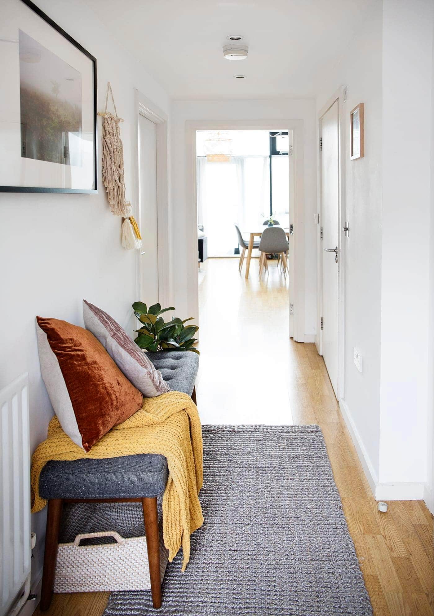 hallway with bench and grey rug