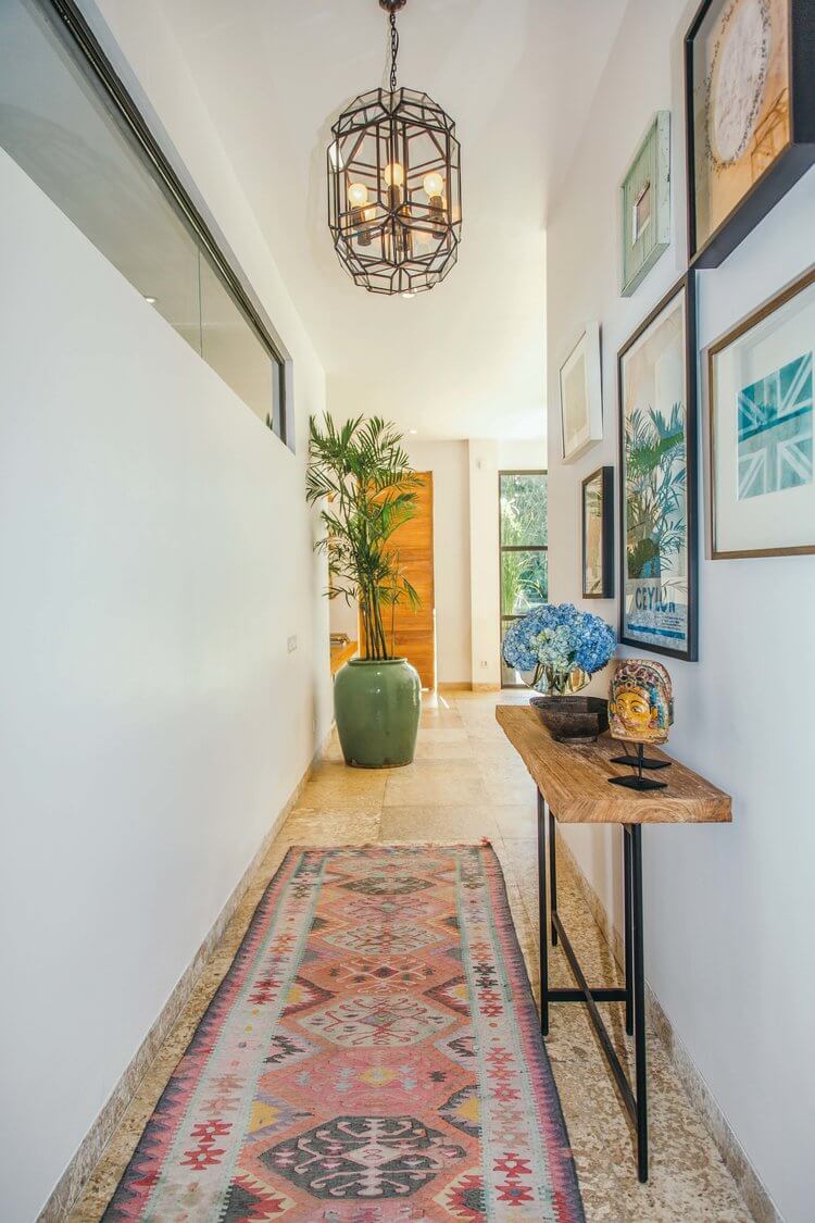 narrow hallway makeover with bright art