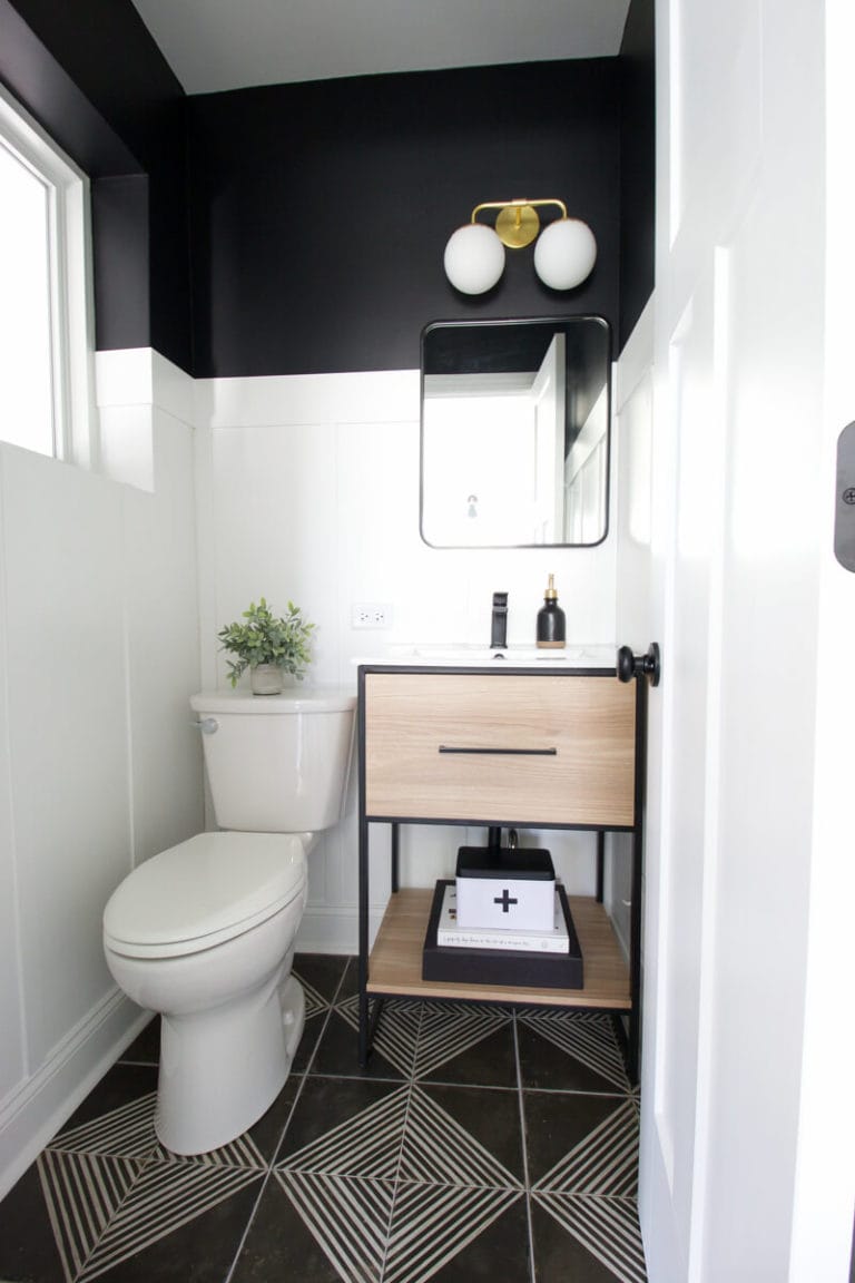 modern black and white powder room with graphic tile floor