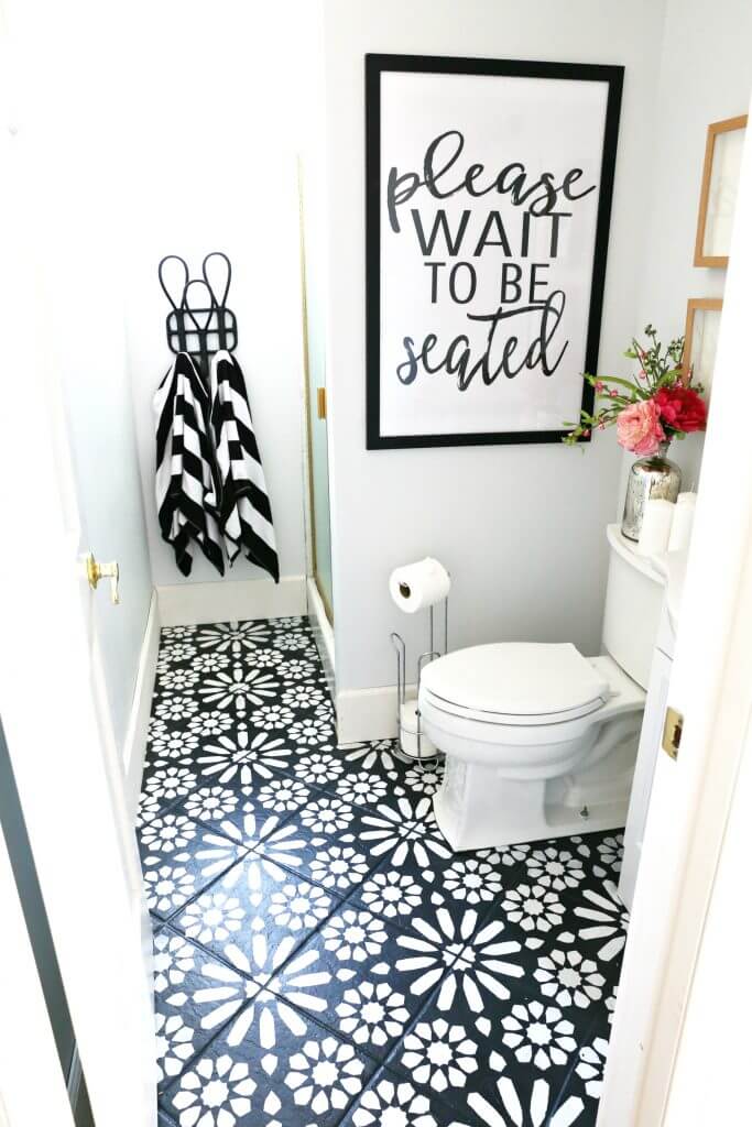 charcoal and white cement tile on powder room floor