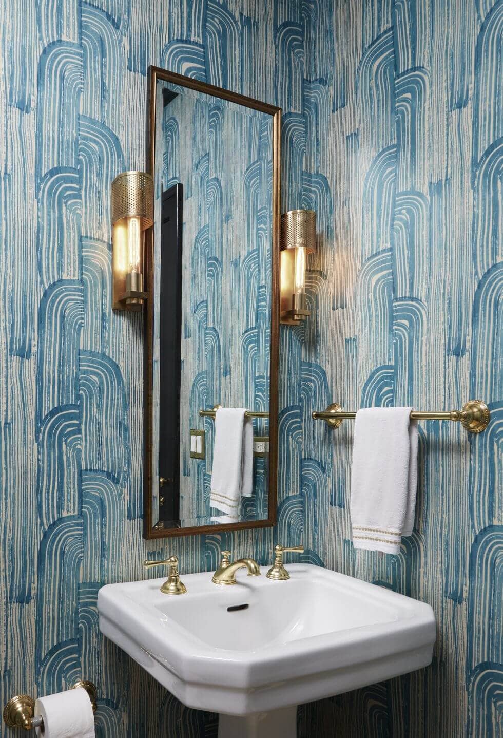 bold turquoise wallpaper and gold finishes