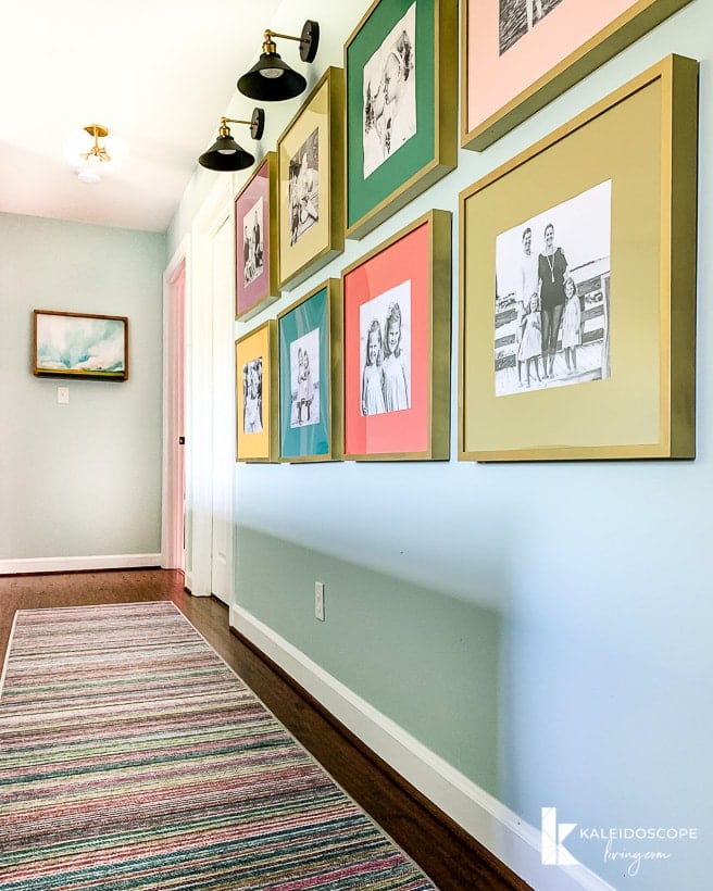 hallway with Ruggable runner and colorful frames