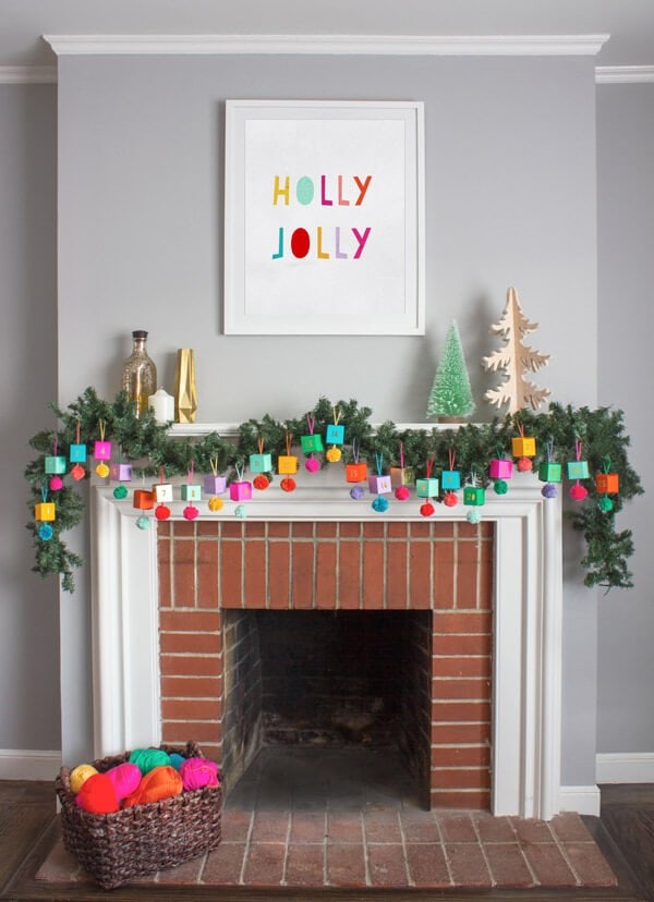 folded paper ornament advent calendar on mantel with garland