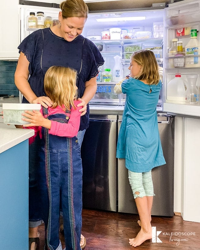 family using organized refrigerator