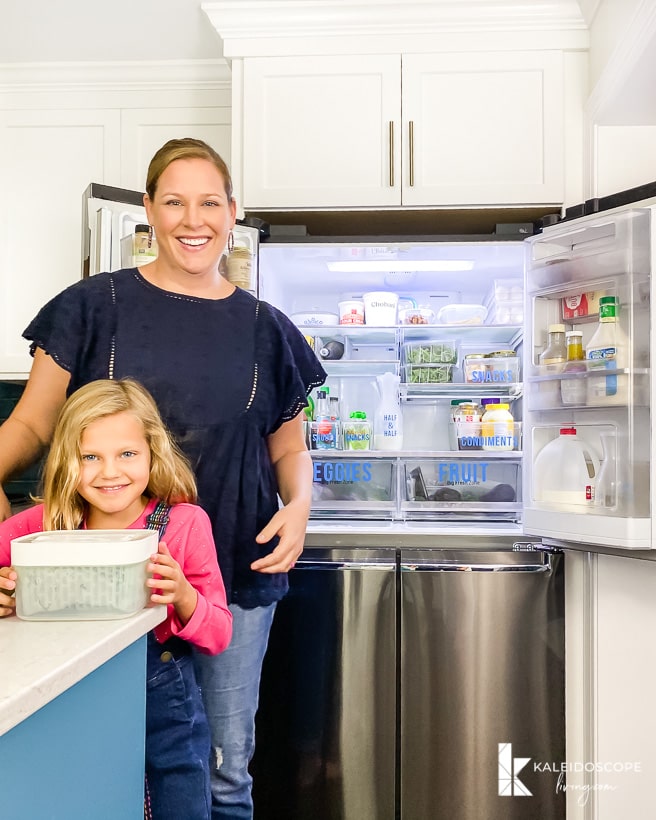 family using organized refrigerator