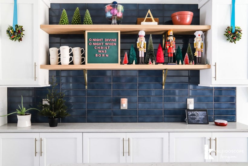 open kitchen shelved with colorful christmas decorations