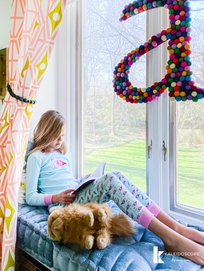 girl's window seat in colorful room