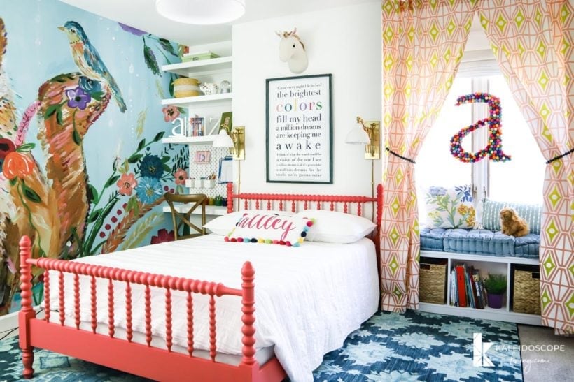 colorful girl's bedroom with wall mural and Jenny Lind bed