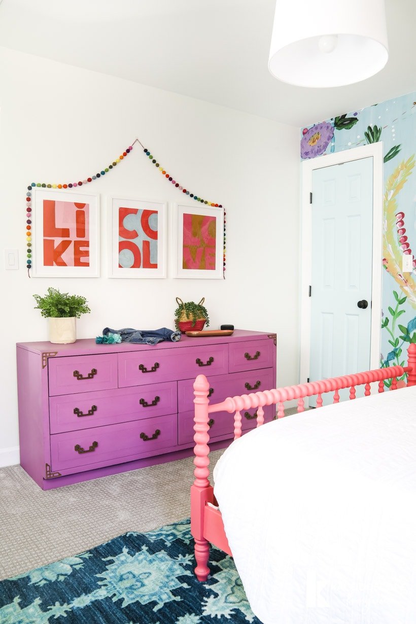 colorful girl's bedroom with purple dresser