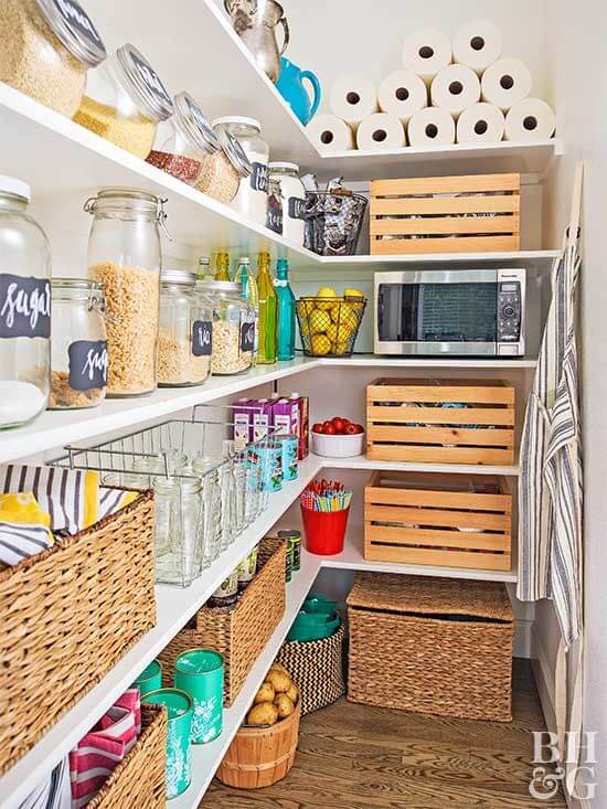 pantry with baskets and wooden bins