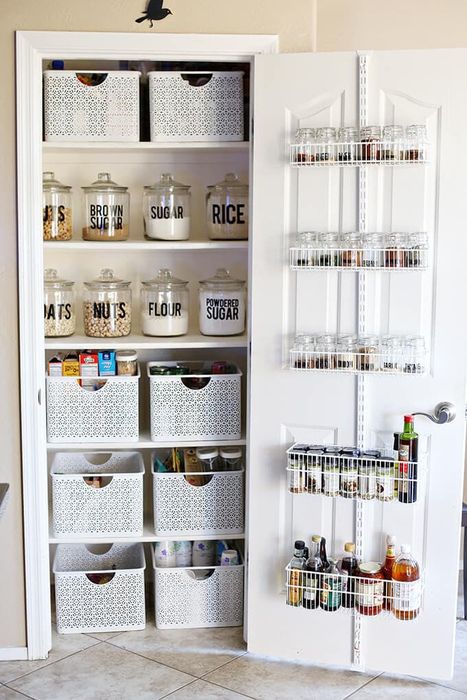 pantry with door storage, basket and jars
