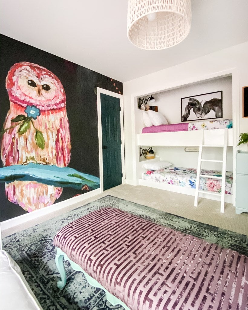 colorful mural accent wall in girl's bedroom