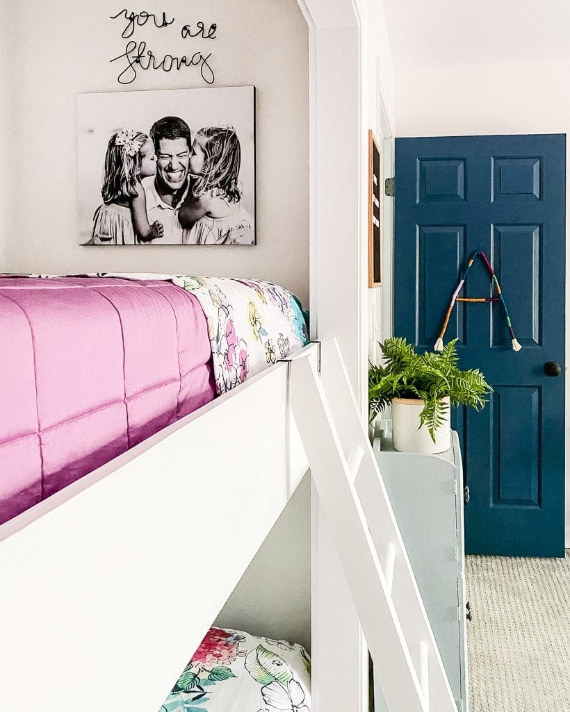 colorful bunk beds with DIY photo canvas on wall