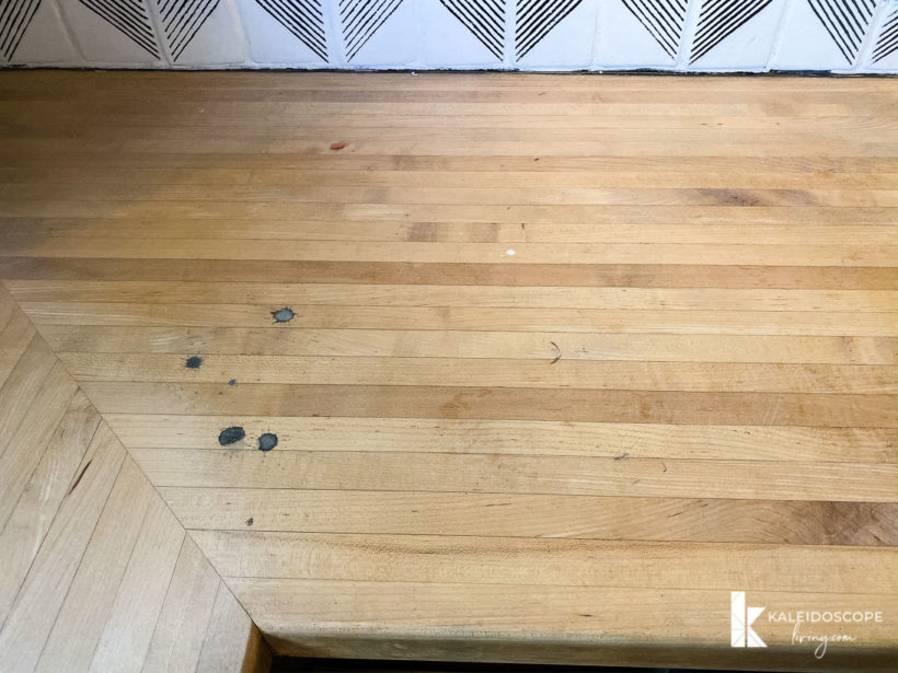 photo of damaged, stained and scratched butcher block countertops in kitchen