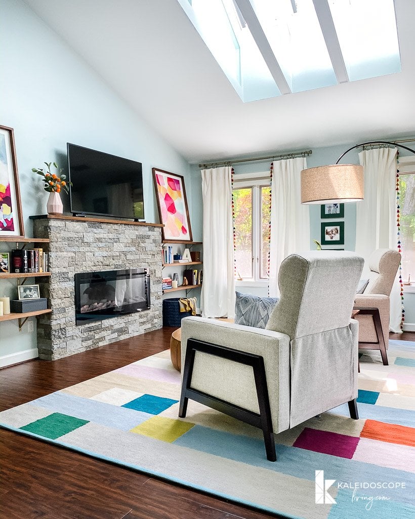 master bedroom sitting area with colorful rug