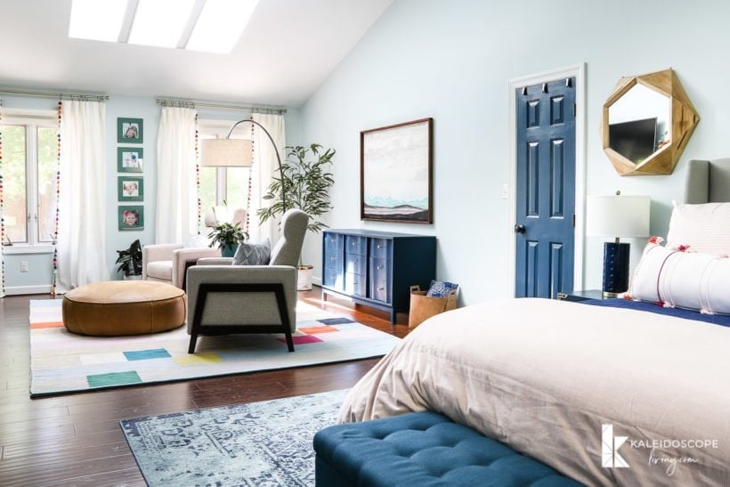 colorful master bedroom with sitting area