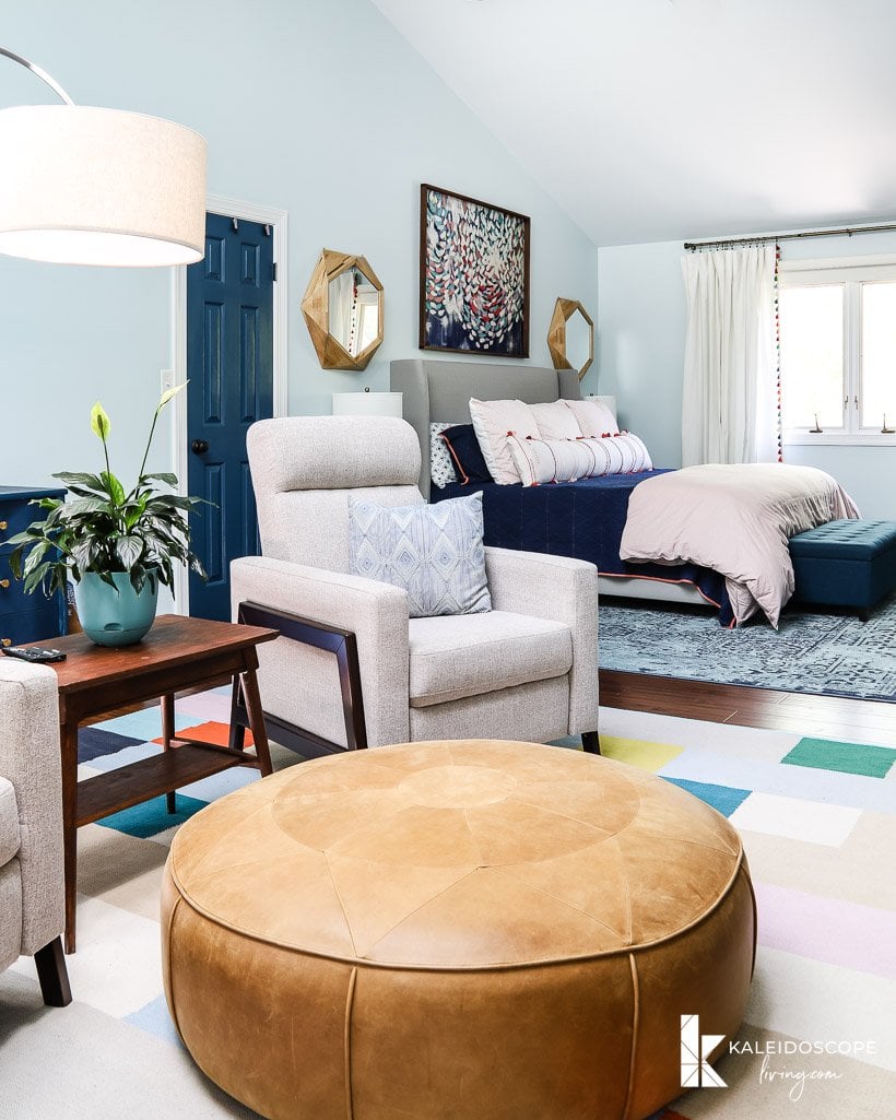 colorful master bedroom with sitting area