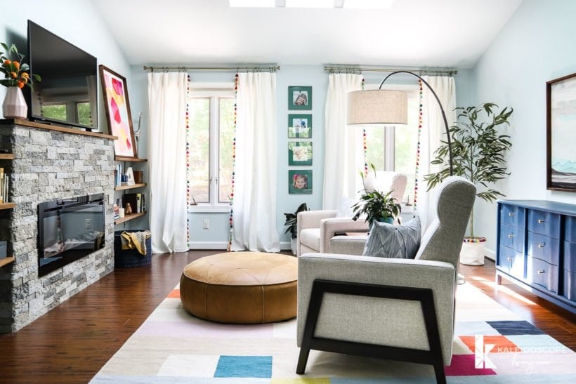 sitting area with curtains with tassels on windows